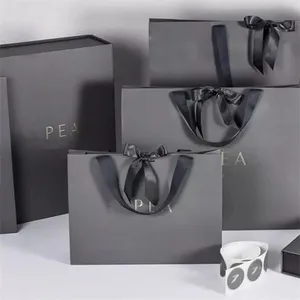 Debossed paper bag silver logo Dubai